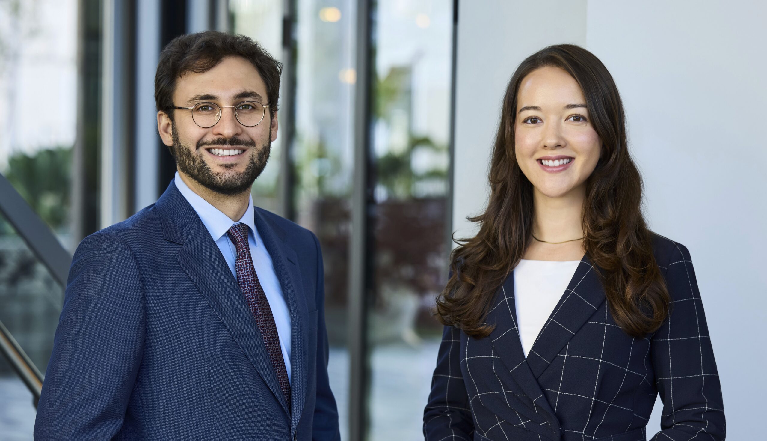 Andrew Howard and Olivia Flechsig Standing in Office